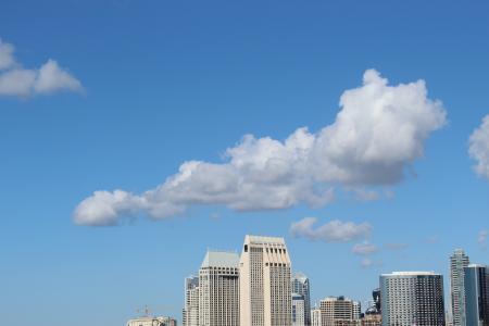 Cumulus Clouds Above High-rise Building