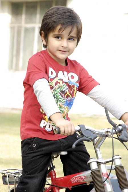 Cute Kid with Bicycle