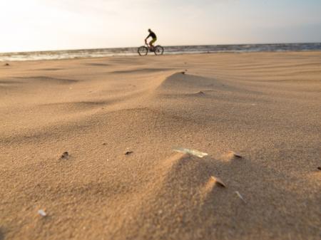 Cycling along the beach seaside