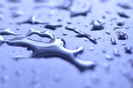 Dew Drops of Water on Blue Surface