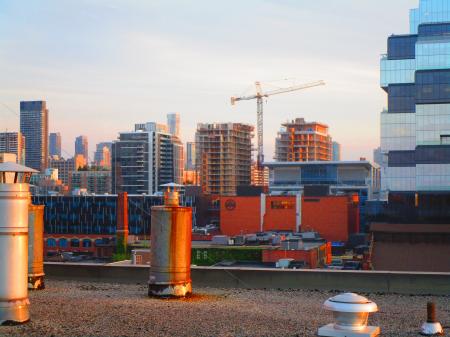 Distant construction cranes on Toronto skyline, at dawn, 2017 06 12 -e