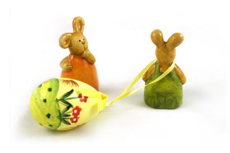 Easter rabbits - one dragging an egg