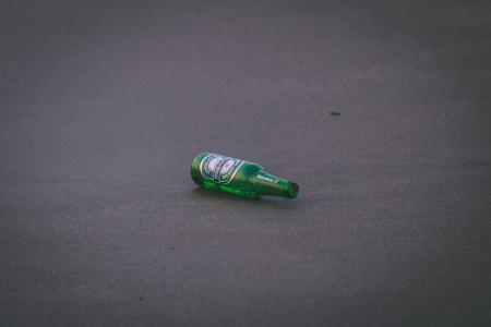 Empty Heineken Bottle on Ground