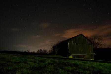 Farm House at Night Under Sky Filled with Stars