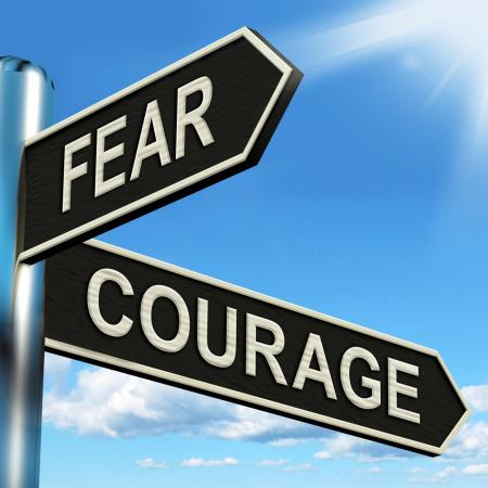 Fear Courage Signpost Shows Scared Or Courageous