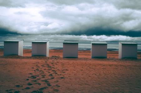 Five White Frames Near Body of Water