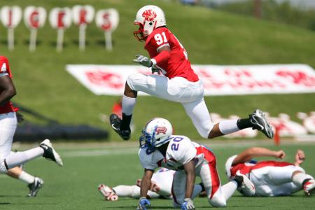 Football Player Pass by over Reaching the Goal