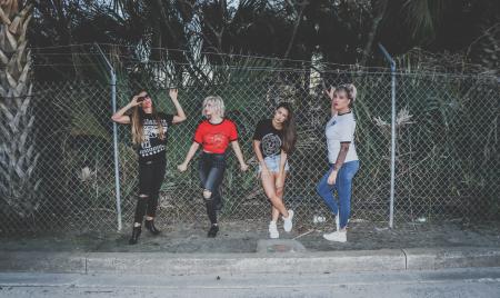 Four Girls Near Fence