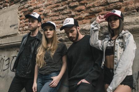 Four Man and Woman Standing Near Building Structure