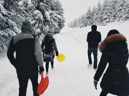 Four People Crossing the Road during Winter Season
