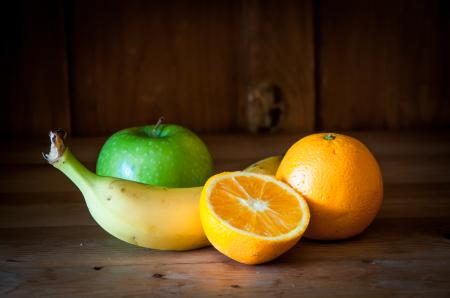 Fresh fruits on wooden background