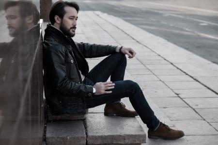 Full Length of Man Sitting in City