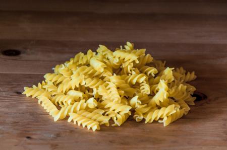 Fusilli pasta on a old wooden background