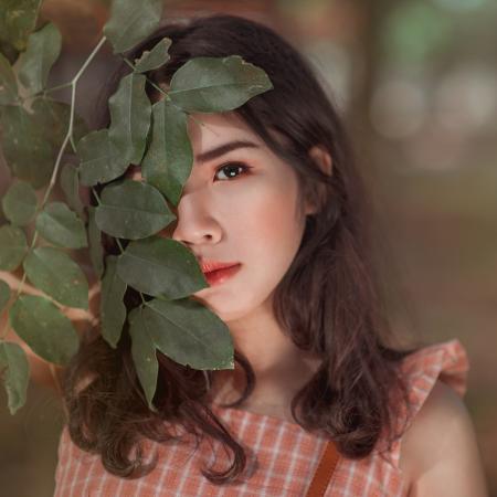 Girl in Orange and White Gingham Sleeveless Dress Close-up Photo