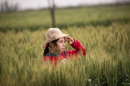 Girl in Red Hoodie Wearing Beige Sunhat