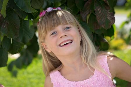Girl Wearing Pink Floral Tank Dress Smiling