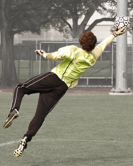 Goalee Player Holding Black and White Soccer Ball