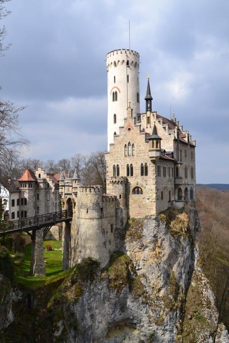 Gray and White Castle Built Near a Cliff