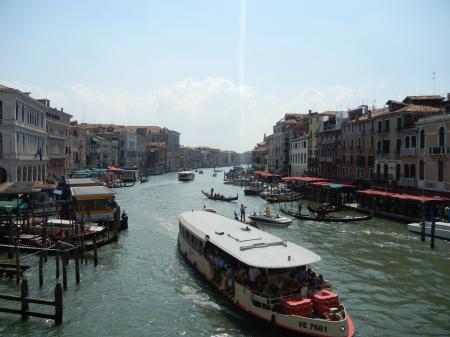 Gray Buildings Near Body of Water With Boats at Daytime