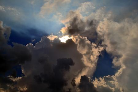 Gray Clouds Cover Sun Under Blue Sky