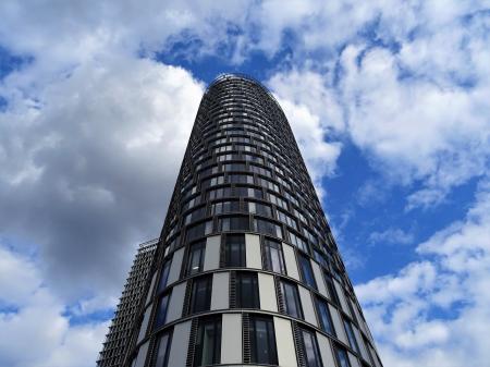 Gray Concrete Building during White Cloudy Skies