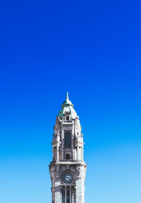 Gray Concrete Clock Tower Under Blue Sky