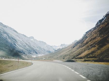 Gray Concrete Road Surrounded With Mountains