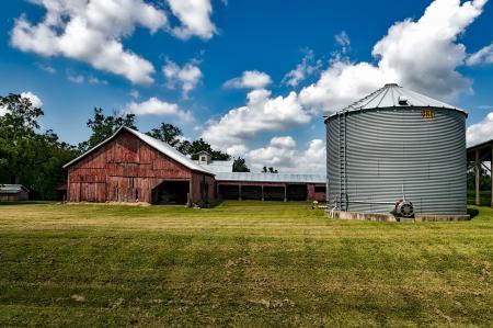Gray Metal Water Tank Under Clear White Blue Sky during Daytime