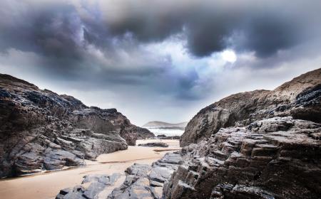 Gray Rock Formation Under Clouds at Daytime