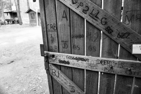 Gray Scale Photo of Brown Wooden Gate