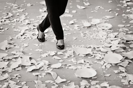 Grayscale of Woman in Black Flat Sandals Walking