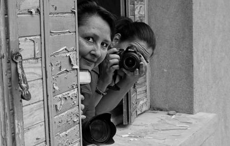 Grayscale Photo of 2 Woman on Window Pane