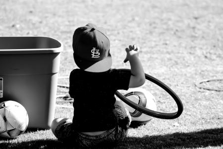 Grayscale Photo of Boy Wearing St. Louis Cap