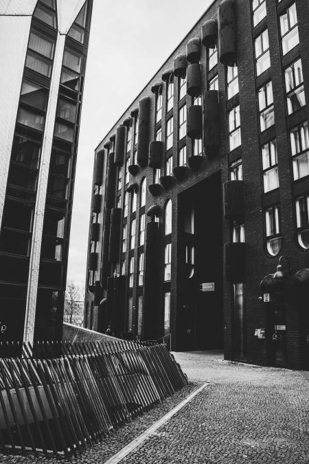 Grayscale Photo of Concrete Buildings