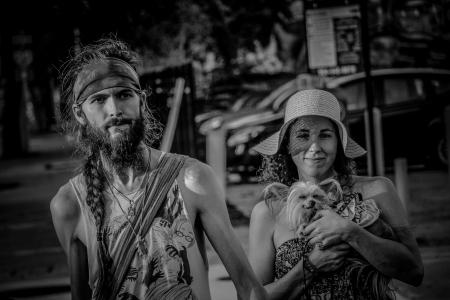 Grayscale Photo Of Couple With Small Dog