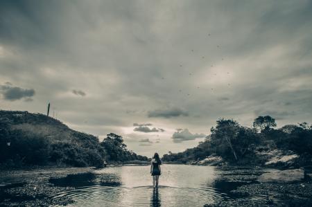 Grayscale Photo of Female on Body of Water