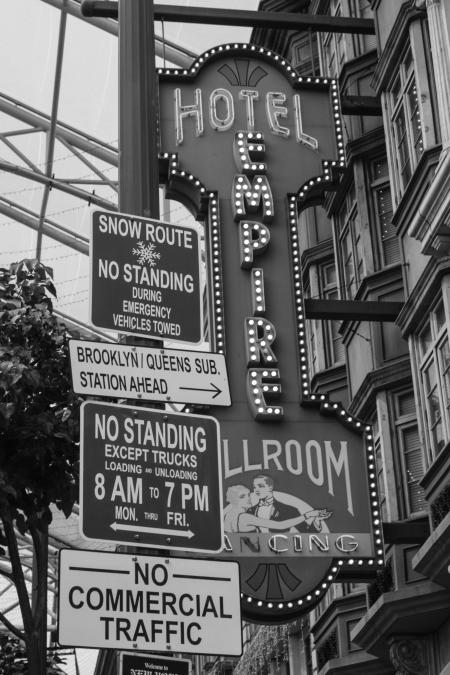 Grayscale Photo of Hotel Empire Signage