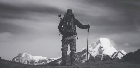 Grayscale Photo of Man Standing on Ground