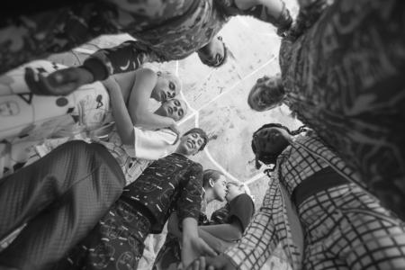 Grayscale Photo of People Together Inside Room