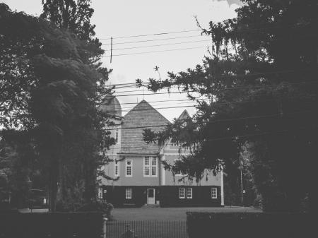 Grayscale Photo of White Concrete Building