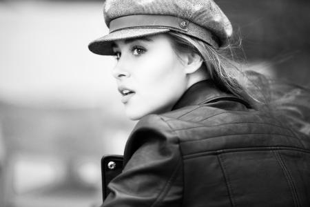 Grayscale Photo of Woman in Black Leather Jacket