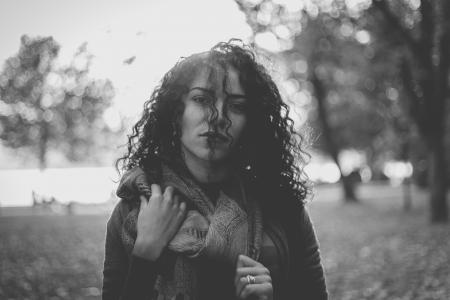 Grayscale Photo Of Woman Wearing Scarf