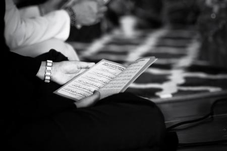 Grayscale Photography of a Person Holding Book