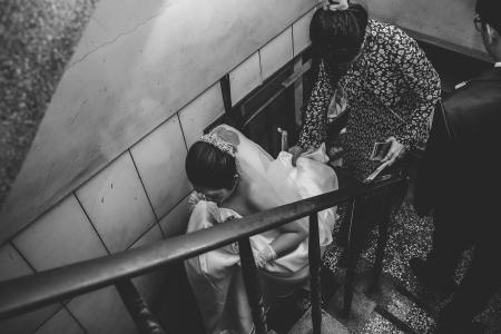 Grayscale Photography of Bride on Stair