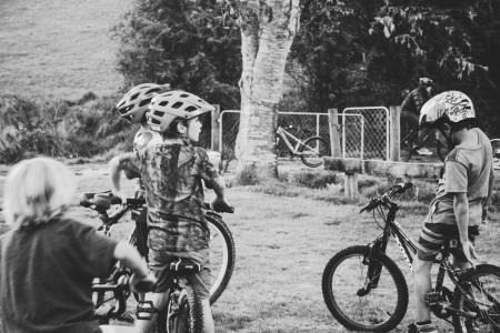 Grayscale Photography of Children Riding Bicycles