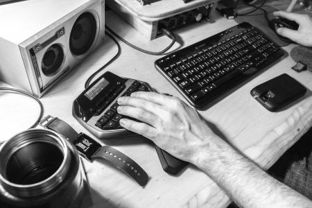 Grayscale Photography of Human Left Hand Near Computer Keyboard