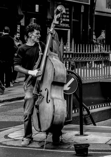 Grayscale Photography of Man Playing Cello