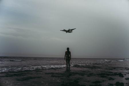 Grayscale Photography Of Woman On Seashore