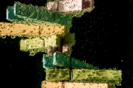 Green and Beige Clothes Clip on Water With Bubble Effect