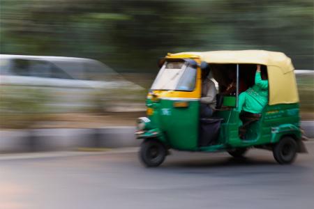 Green and Yellow 3 Wheeled Vehicle